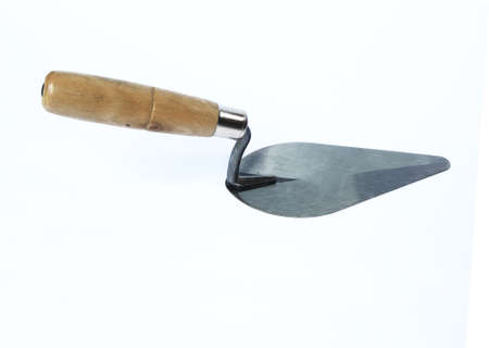Old steel trowel isolated on white background.の写真素材