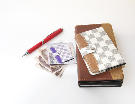 Pen to take notes, cash accounting system.の写真素材