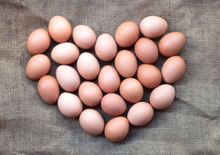 Fresh eggs on the background of hemp sacks.の写真素材