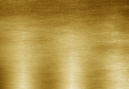 Shiny yellow leaf gold foil texture backgroundの写真素材