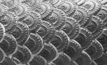 Scales of the dragon statue. Stucco surface of the animalの写真素材