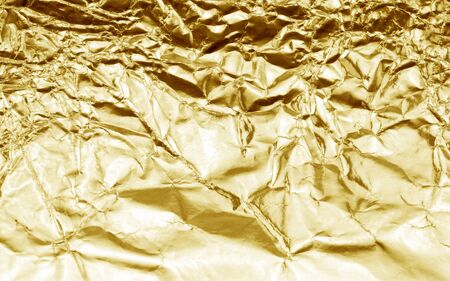 Shiny yellow leaf gold foil texture background