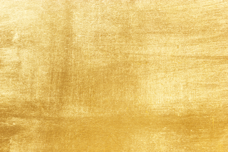 Shiny yellow leaf gold foil texture backgroundの写真素材