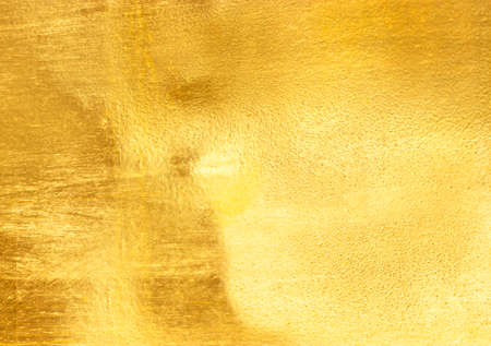 Shiny yellow leaf gold foil texture background