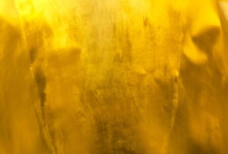 Shiny yellow leaf gold foil texture background