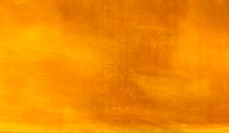 Shiny yellow leaf gold foil texture backgroundの写真素材