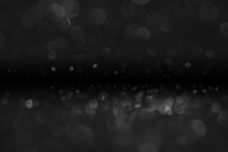 bokeh of water fly and lights on black backgroundの写真素材