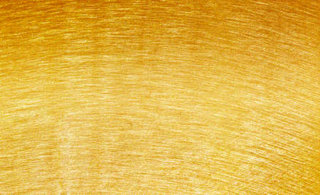 Shiny yellow leaf gold foil texture backgroundの写真素材