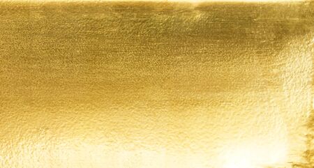 Shiny yellow leaf gold foil texture background