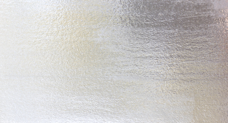Shiny yellow leaf Silver foil texture backgroundの写真素材