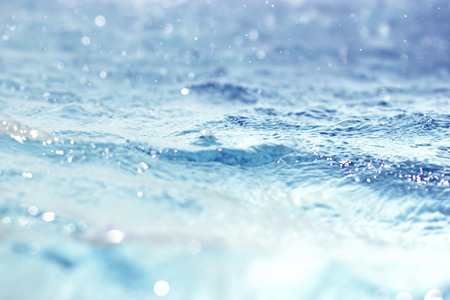 Bokeh light background in the pool / Water surface blue background