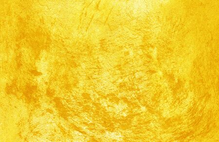 Cement wall texture golden yellow background decorative design.の写真素材