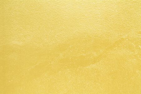 Golden cement wall  background golden abstract yellow