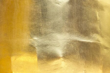 gold polished metal steel texture abstract background.の写真素材