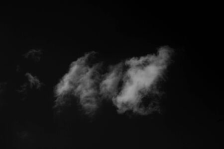 White smoke isolated on a black backgroundの写真素材