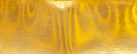 gold polished metal steel texture abstract background.の写真素材