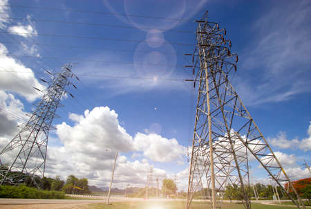 power poles pole with wires against a blue sky