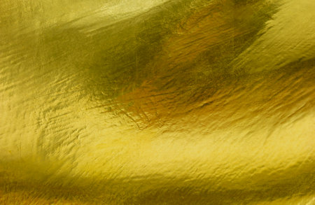Metal Gold Background Shiny yellow leaf gold texture backgroundの写真素材