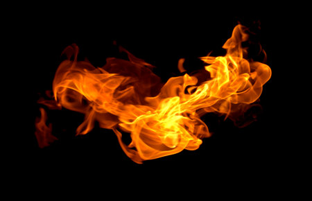 Flame heat fire abstract background black backgroundの写真素材