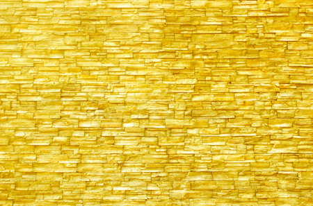 Golden stone wall texture background interior design