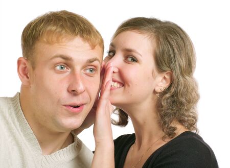 Young couple talking. Isolated on a white background.