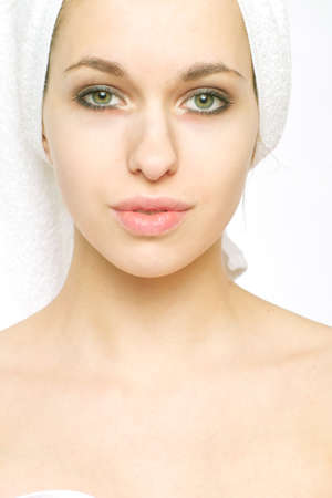 Portrait of beautiful young woman on a white backgroundの写真素材