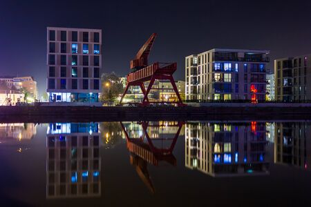 Old Crane at Bremerhaven's Harbor During Nightの写真素材