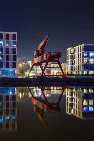 Old Crane at Bremerhaven's Harbor During Nightの写真素材
