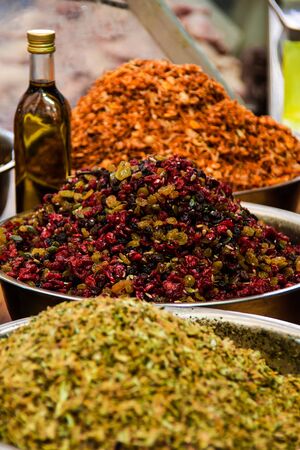 Bowls of spices being sold at the marketの写真素材