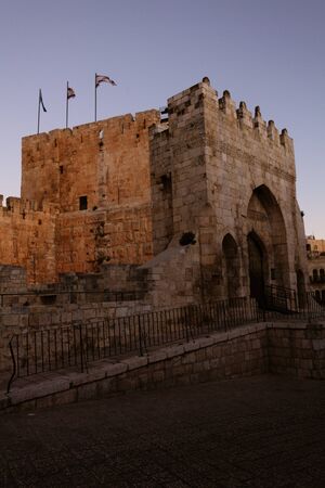 The entrance to the Tower of David in the Jaffa Gate in the old city of Jerusalem. The flags of...