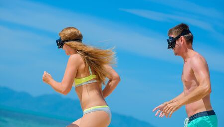 Young couple - newlyweds - having fun at the tropical beach of Ko Samuiの写真素材