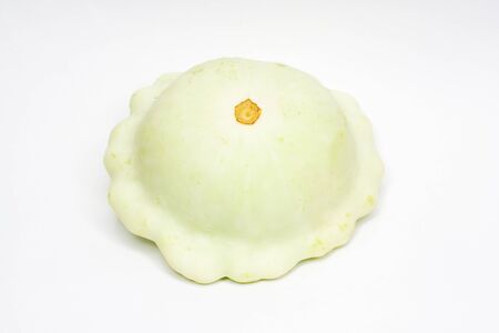 Scallop squash on white background の写真素材