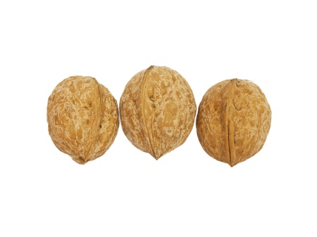 three circassian walnuts isolated on white の写真素材