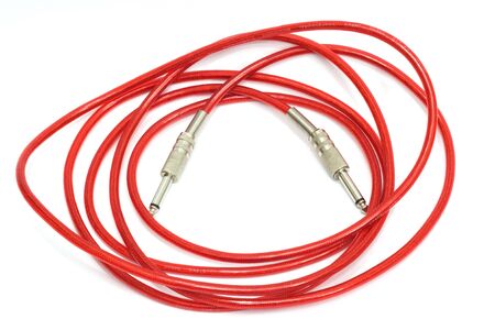 Electric guitar patch cable isolated on white の写真素材
