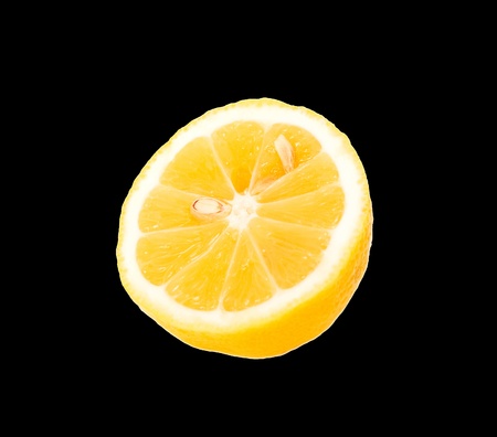 fresh yellow lemon insulated on black with cutting off the wayの写真素材