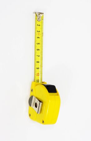 roll-up tape measure isolated on a white background の写真素材