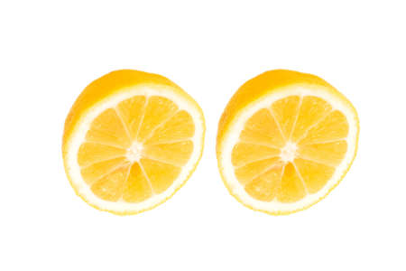 fresh lemon halves on white backgroundの写真素材
