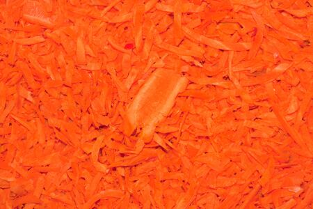 Grated carrots background. Close-up. 