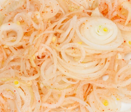 onions sliced rings with pepperの写真素材