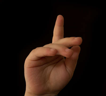 Hand of the child on a black backgroundの写真素材