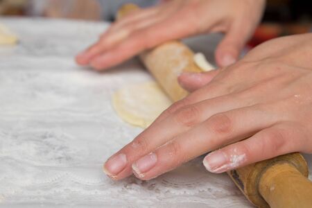woman hands knead dough の写真素材
