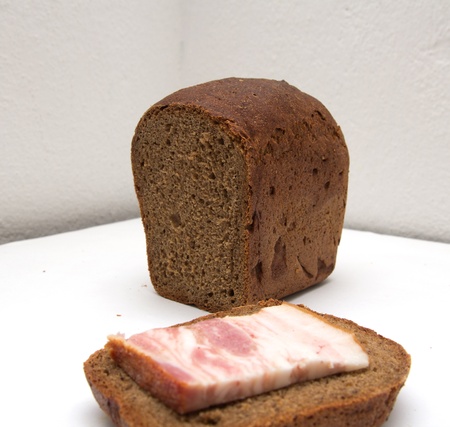 bacon with rye bread on a white background