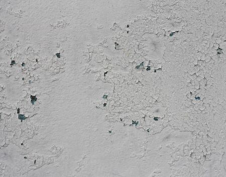 shabby old white paint on a rusty metal in the background