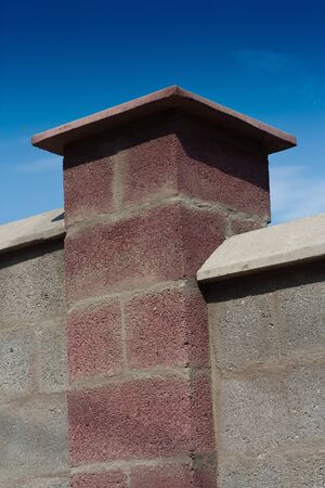 brick wall against blue sky