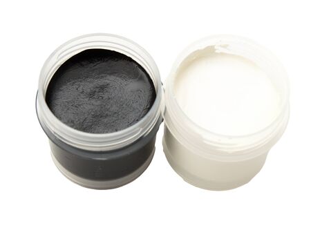 Jars with black and white gouache. Isolated on white background