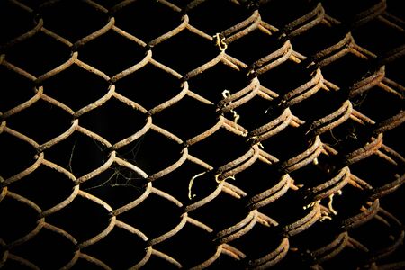 rusty grid on a black backgroundの写真素材
