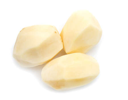 peeled potatoes on a white backgroundの写真素材