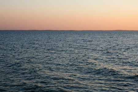 the sea at sunset as a backdrop