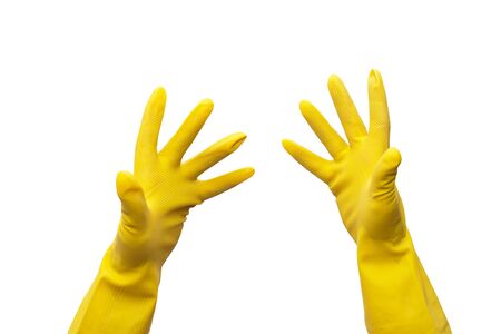 yellow rubber gloves on white backgroundの写真素材