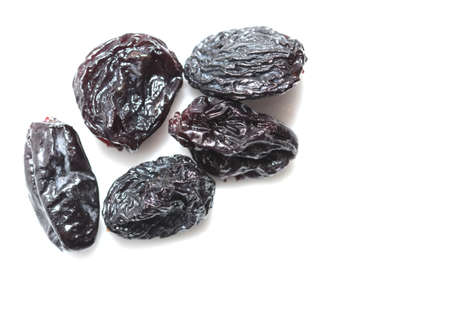 black raisins on a white backgroundの写真素材